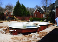 Set the Fiberglass pool shell into the excavated whole